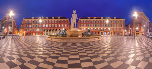 Panorama of square Place Massena with Fountain du Soleil at night in Nice, French Riviera, France