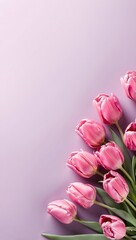 Obraz premium Bouquet of pink tulips on a purple background. Place for text.
