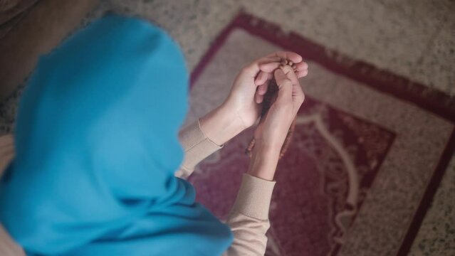 Muslim woman praying hijab Islam in Ramadan .