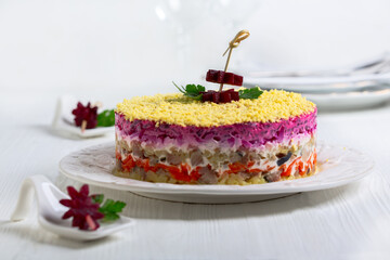 Traditional salad with herring and vegetables.