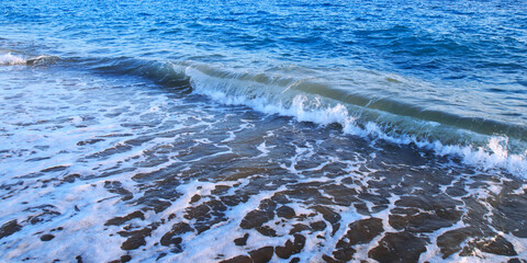 Beautiful Seascape. Turbulent the sea. Vacation and summer concept. Landscape. Powerful Ocean blue waves with white foam. Sea waves. Blue sea water background. Blue ocean background. Bubbling Sea wave