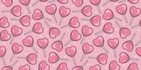 Sweet candy. Background with  pink heart shaped lollipop. Background for Valentine’s Day and romantic holidays.