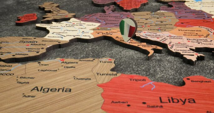 Italy - Travel concept pushpin on the world map. The location point on the map points to Rome the capital of the Italy.