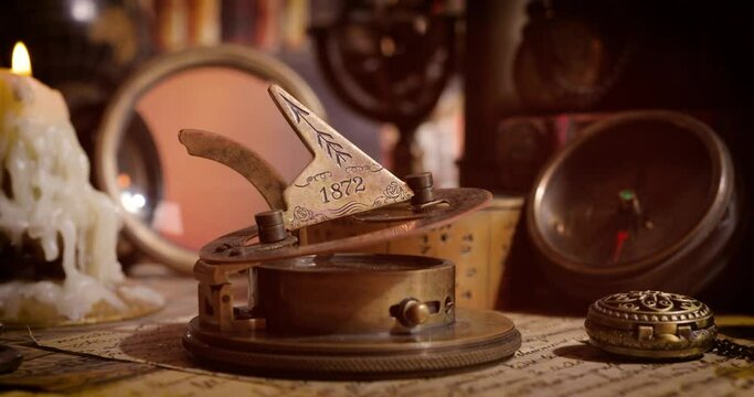 Vintage style travel and adventure. Vintage old compass and other vintage items on the table.