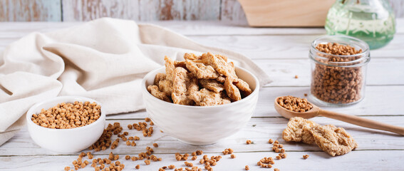 Dry dehydrated soy steaks and soy minced meat in bowls on the table web banner