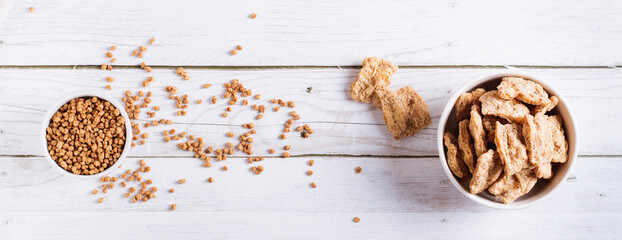 Alternative protein dry soy meat in a bowl on the table top view web banner