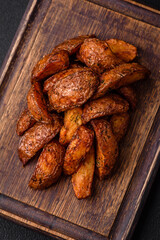Delicious crispy potato wedges with garlic, salt, spices and herbs