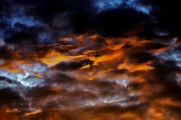 an extraordinary mesmerizing view of the gloomy fiery sky at dawn