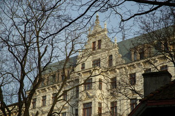 Riga in winter, view of an Art Nouveau building through a pattern of trees. Riga, Latvia. High quality photo