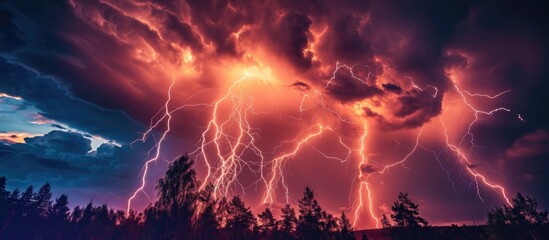 Fototapeta na wymiar Intense lightning strikes near trees.