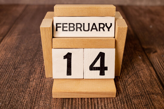 Wooden calendar show of February 14 with red heart