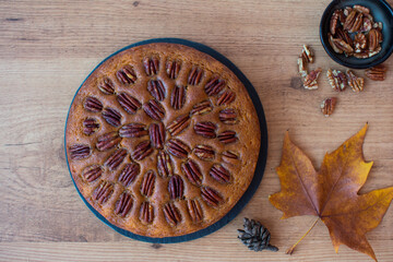 Pecan pie on wooden table, top view.