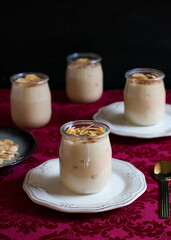 Desserts in glass with laminated almonds