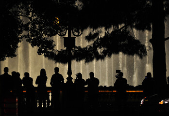 Silhouette of tourists watching a fountain show at night in Las Vegas, Nevada, southwest USA.