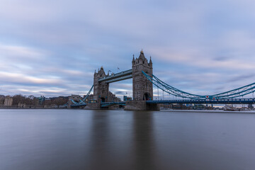 View of Tower Bridge on river Thames in long exposure