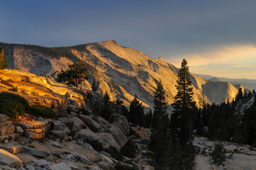 Beautiful sunset light on the granite slopes and boulders around Olmsted Point, Yosemite National Park, California, USA.