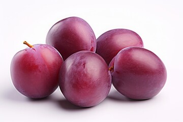 Obraz premium purple plum isolated on a white background. violet fruit, a bunch of berries.