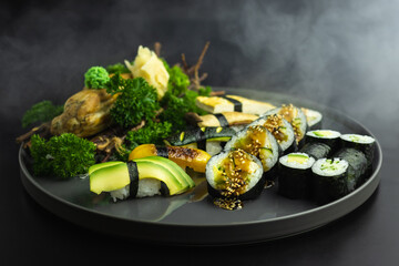 luxury vegan sushi on a black plate 
