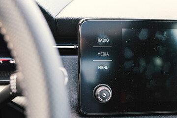 Many fingerprints on a touchable infotainment black screen interior car