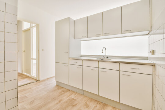 Modern minimalist kitchen with white cabinetry