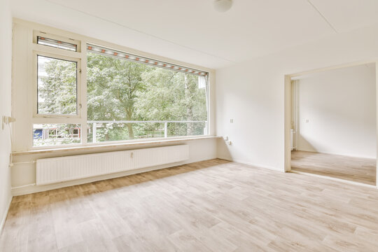 Bright and spacious empty room with large windows