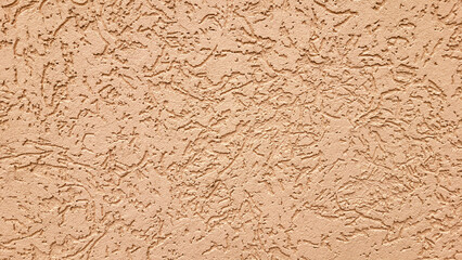 The texture of Peach Fuzz gypsum bark beetle on the wall. Seamless texture