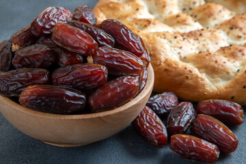 Date fruits and traditional Ramadan pita,closeup