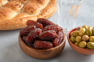 Traditional iftar table with dates, pita, green olives 