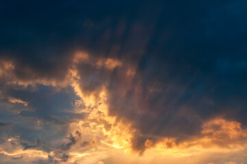 Fototapeta premium Abstract colorful background. Beautiful red sunset over a small town. Dramatic sunset sky with clouds. 