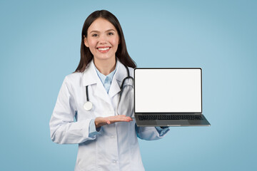 Doctor woman presenting laptop with blank screen