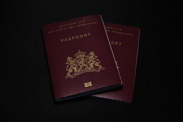 two passports with black background