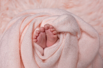 twisted child. Soft feet of a newborn	
