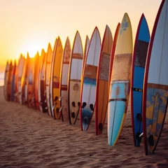 Foto op Canvas Surfboards on the beach at sunset. Colorful surfboards background. Surfboards with abstract pattern. Surfboards on the beach. Vacation Concept. Panoramic banner with copy space. © John Martin