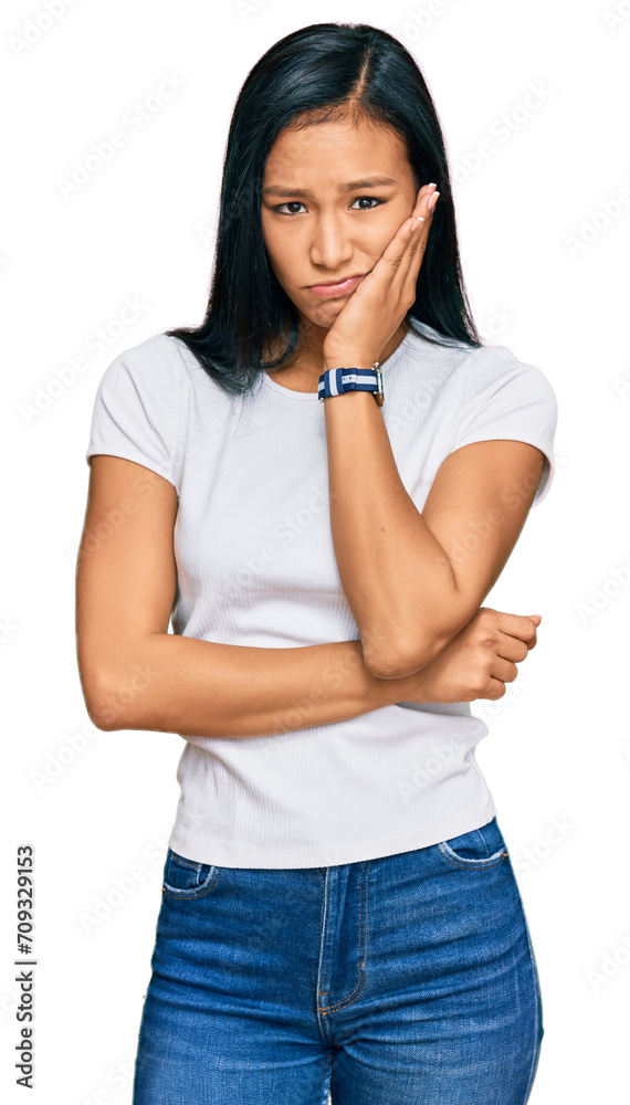 Canvas Prints beautiful hispanic woman wearing casual white tshirt relaxed with serious expression on face. simple