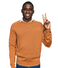 Young african american man wearing casual clothes smiling with happy face winking at the camera...