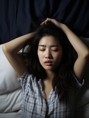 Generative AI : Young Asian woman in her bed suffering from headache