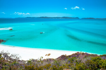 Boats transporting tourists to Whitehaven Beach is on Whitsunday Island. . The beach is known for its crystal white silica sands and turquoise colored waters. Autralia, Dec 2019