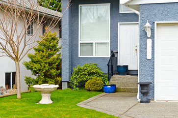 A nice entrance of a house with beautiful landscape.