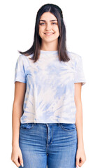 Fototapeta premium Young beautiful girl wearing casual t shirt with a happy and cool smile on face. lucky person.