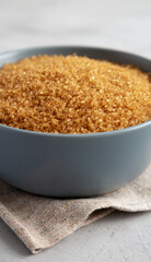 Organic Brown Sugar in a Bowl, side view. Close-up.