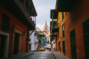 Quaint colonial street leading to a historic church in Cartagena, Colombia