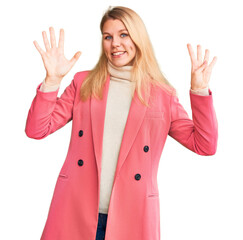 Young beautiful blonde woman wearing elegant clothes showing and pointing up with fingers number...