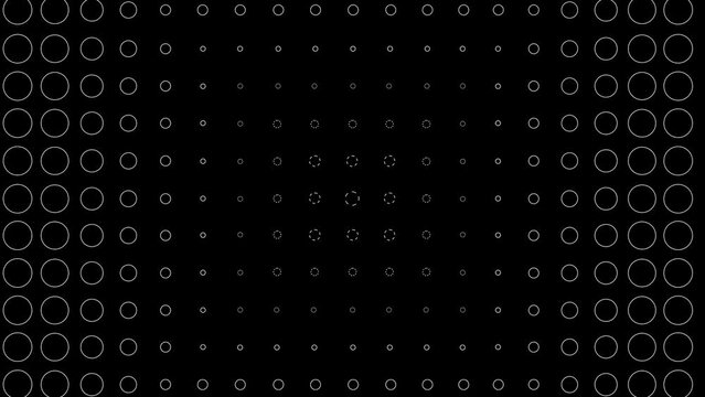 many repeating black and white circular shapes on a black background. geometric shapes with amenia with a delay and copy the movement