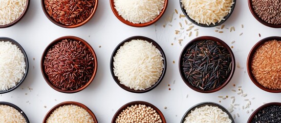 A variety of rice types displayed from above in bowls against a plain background.