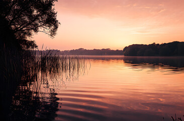 Fototapeta premium Tranquil Lake Sunset with Reflective Water