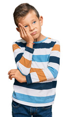 Adorable caucasian kid wearing casual clothes thinking looking tired and bored with depression problems with crossed arms.