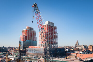 Construction site with new apartment buildings and cranes in Gowanus, Brooklyn, NY