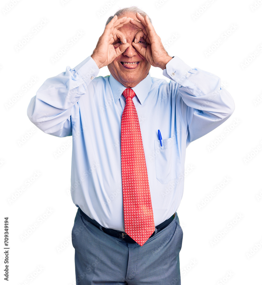 Sticker Senior handsome grey-haired man wearing elegant tie and shirt doing ok gesture like binoculars sticking tongue out, eyes looking through fingers. crazy expression.