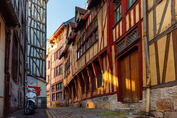 Fototapeta premium Old cozy street with typical timber frame houses in old town of Rouen, Normandy, France. Architecture and landmarks of Normandie