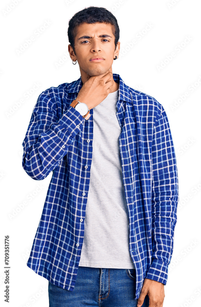 Wall mural Young african amercian man wearing casual clothes touching painful neck, sore throat for flu, clod and infection